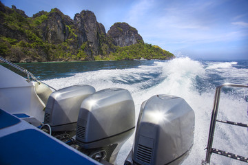 Trace motor boats on the water of a ocean