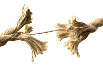 Rope splitting apart held together by one thread - obrazy, fototapety, plakaty