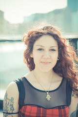 young beautiful hipster woman with red curly hair