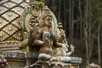Fototapeta na wymiar Hindu gods and demons on a temple, Sri Lanka