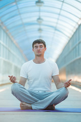 Fototapeta na wymiar Man meditating lotus position