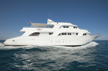 Fototapeta na wymiar Private motor yacht at sea