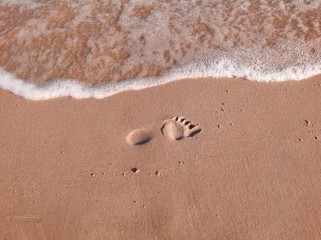 Fototapeta na wymiar Footprint on sandy beach