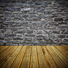  Wooden deck floor and brick wall