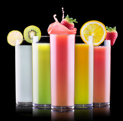 tasty summer fruits with juice in glass