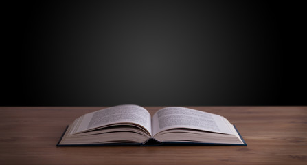 Open book on wooden deck