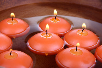 Beautiful candles in water close-up