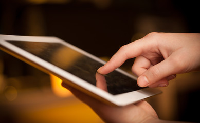 Finger pointing on tablet pc with empty space