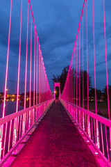 The metal rope bridge  in the park at twilight time