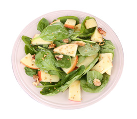 Green salad with apples, walnuts and cheese isolated on white