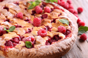 Tasty cake with berries on table close-up