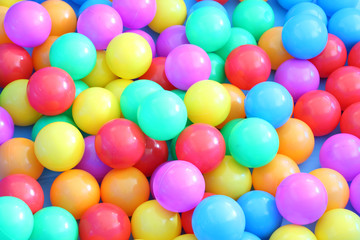 Fototapeta na wymiar Plastic multiple color balls children play field.