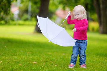 Adorable little girl having fun outdoors © MNStudio