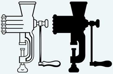 The old manual meat grinder. Image isolated on blue background