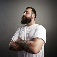 tattooed brutal man wearing white t-shirt