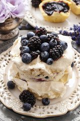 Pavlova cake with blueberries and blackberries