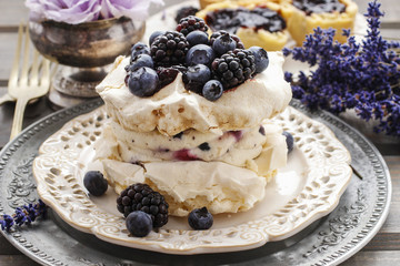 Pavlova cake with blueberries and blackberries