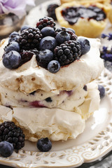 Pavlova cake with blueberries and blackberries