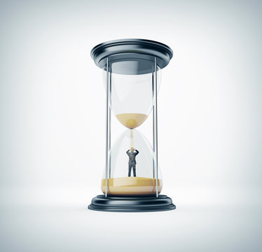 Hourglass with businessman inside