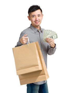 Asian Man With Paper Bag And Cash