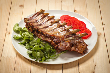 Plate with roasted pork ribs