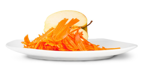 Half An Apple With Grated Carrot On White Plate