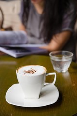 cup of cappuccino on table