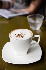 cup of cappuccino on table