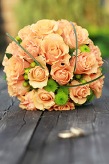 two gold rings and bouqet