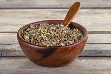 Home made healthy mint tea in a wooden bowl