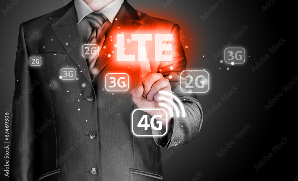 Wall mural businessman is pushing his finger on lte button