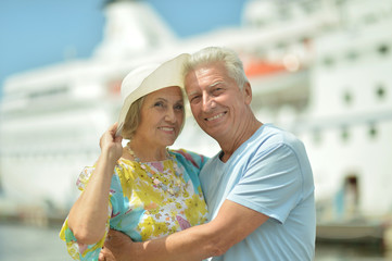 Senior couple standing on pier