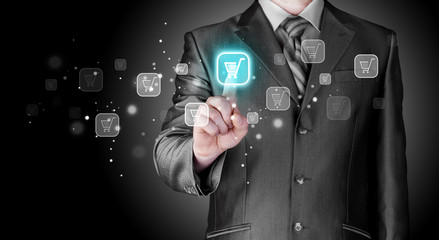 Businessman pushing shopping cart