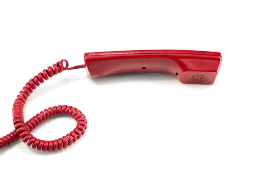 Red telephone receiver isolated on a white