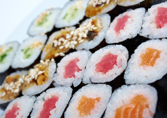 Roll made salmon, eel, tuna, vegetables