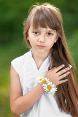 portrait of little girl outdoors in summer