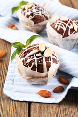 Tasty cupcakes with nuts on table close-up