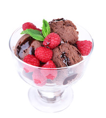 Chocolate ice cream with mint leaf and raspberries in glass