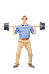 Fototapeta na wymiar Full length portrait of a casual guy lifting a weight
