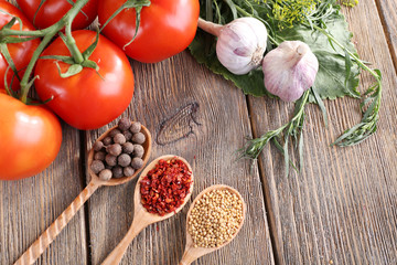 Fresh vegetables with herbs and spices on table, close-up