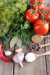 Fresh vegetables with herbs and spices on table, close-up