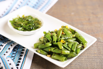 Salad with green beans and corn with sauce