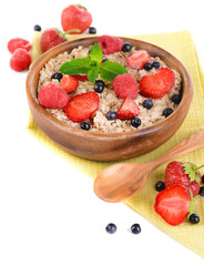 Tasty oatmeal with berries isolated on white