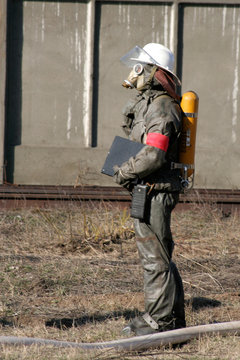 firefighters in chemical protection suit