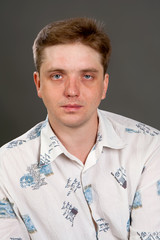 man posing in white shirt