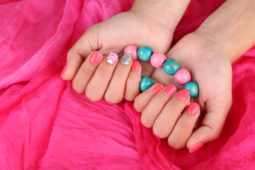 Female hand with stylish colorful nails,