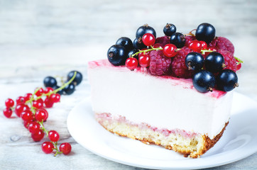 cheesecake with raspberries, red and black currants