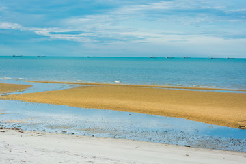 Fototapeta na wymiar Beach with fishing boats on the sea