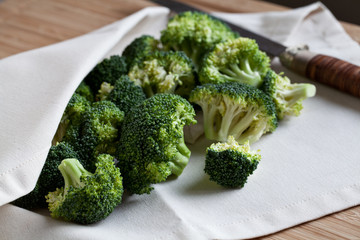 green broccoli on wooden board