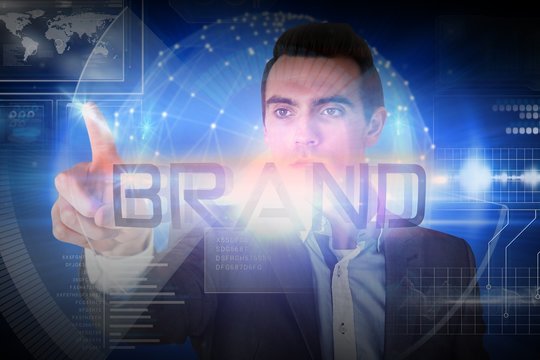 Businessman presenting the word brand